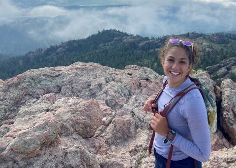 Olivia Black, former COFO DFP, hikes to Horsetooth Rock