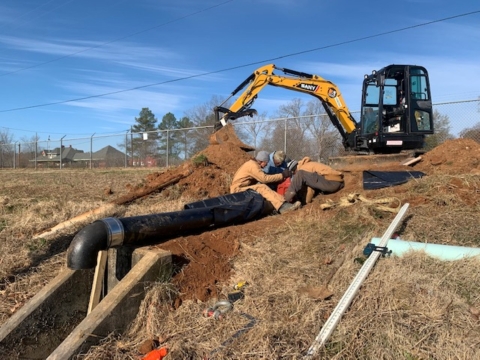 Contractors working on a valve for a pipeline project.