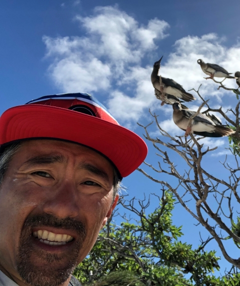 James Kwon with red-footed boobies in the background.