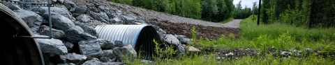 A new, wide culvert under a road improves fish passage in O'Brien Creek in Wasila, AK.