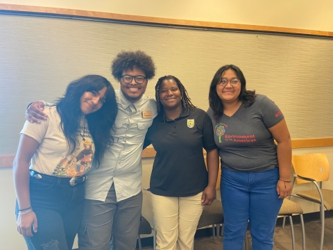 Picture of Interns from.Left to right, Kenia Villagran and Izaiah McQueen, Dr. Nicole Hams and intern Suzena Arias.sstanding in a classroom. 