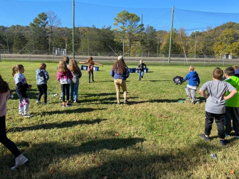Kids playin in a field 