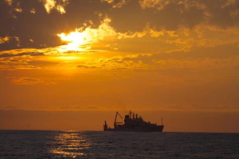 NOAA Ship PISCES silhouetted in the sunset in the Gulf of Mexico