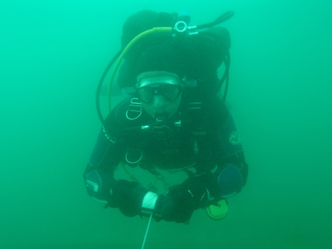 scuba diver swimming underwater