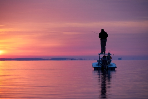 Sunset fishing on a boat