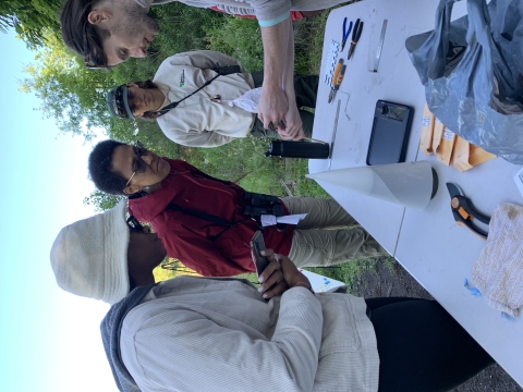 Birders examine how bands are placed on birds