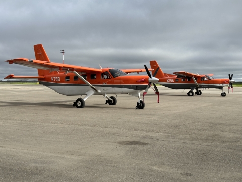 two airplanes on a runway