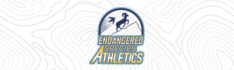 A logo that says "endangered species athletics" featuring a bighorn sheep climbing a mountain and a bird flying in the air