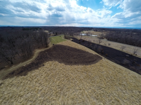 Aerial view taken by drone of a prescribed burn at the National Conservation Training Center