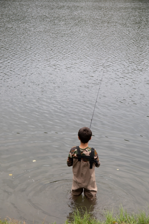Child fishing in Taku Lake. Partner Anchorage Refugee Assistance Program