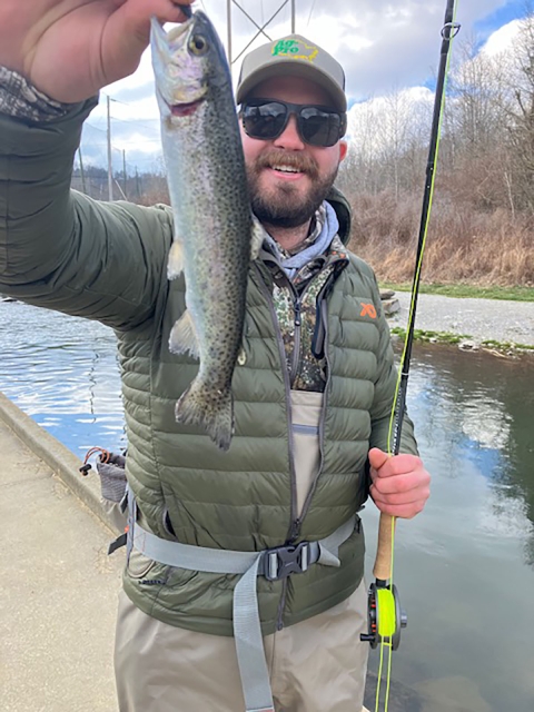 Angler holding rainbow trout