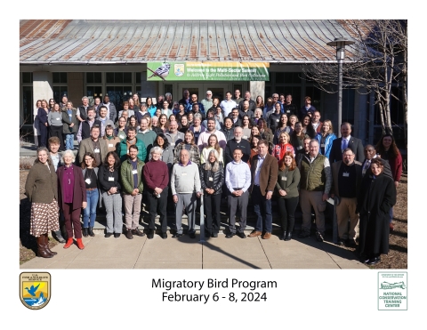 Migratory Bird Program group attending the Multi-Sector Summit to Address Light Pollution and Bird Collisions poses for a photo outside the National Conservation Training Center