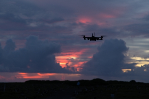  Drone with a thermal camera landing at sunrise