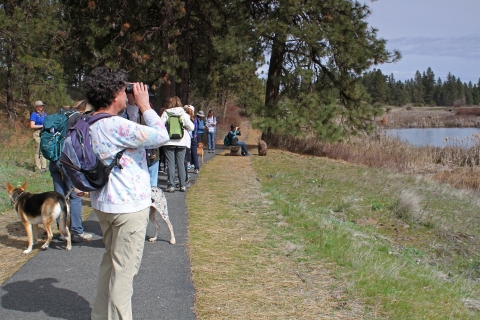 A FWS gives a guided bird tour to a group of women