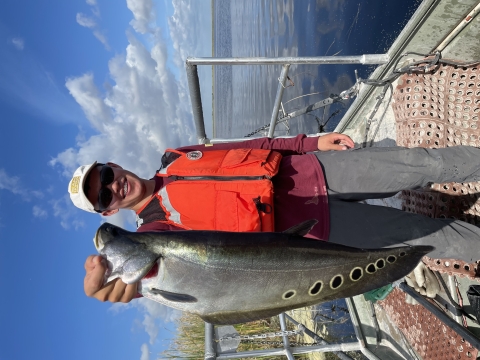 Arthur R. Marshall Loxahatchee NWR intern Ian Jin displaying a non-native clown knifefish collected during electrofishing surveys of the Refuge's perimeter canals.