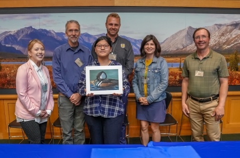 2023 National Junior Duck Stamp winning artist with judges at the contest held at the National Conservation Training Center
