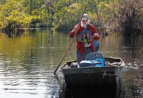 John S. Quarterman, the Suwannee Riverkeeper, shown maneuvering his boat on the Suwannee River near Fargo, Ga.