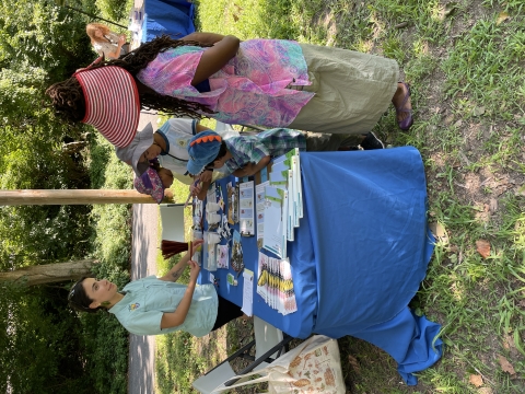 Julia talking with participants at Latino Conservation Day event