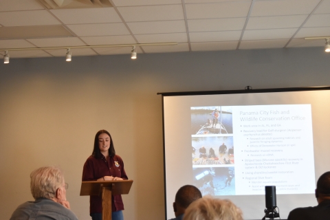 Speaker at podium presentation