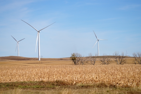 Three wind turbines in a field