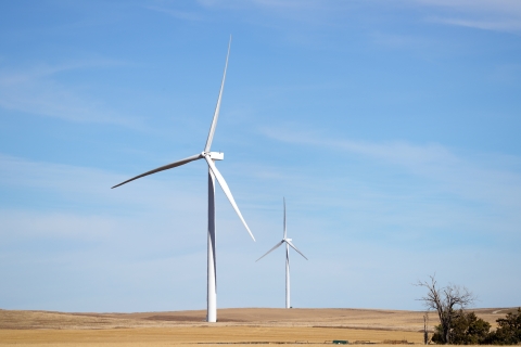 Two wind turbines in a field