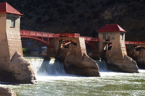 A dam with flowing water on a river