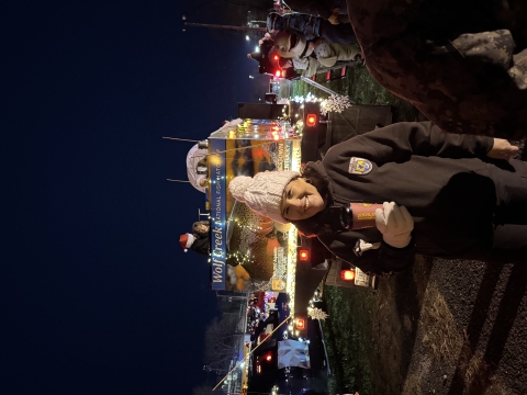 USFWS employee in front of decorated fish truck