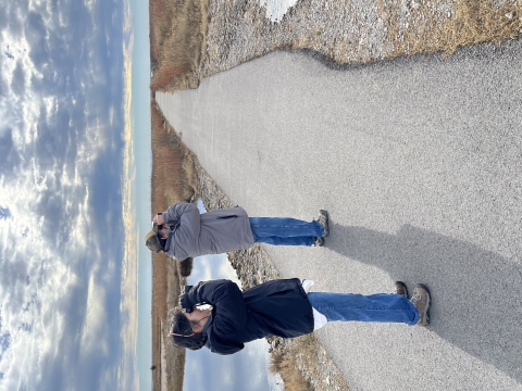Two adults birding with binoculars at Sandpiper Trail on Salt Plains National Wildlife Refuge.
