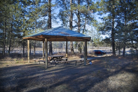An outdoor pavilion and picnic table