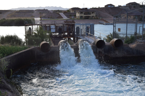 A pump on a river pushing water out