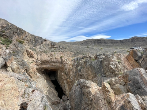 A small pool of water surrounded by rock