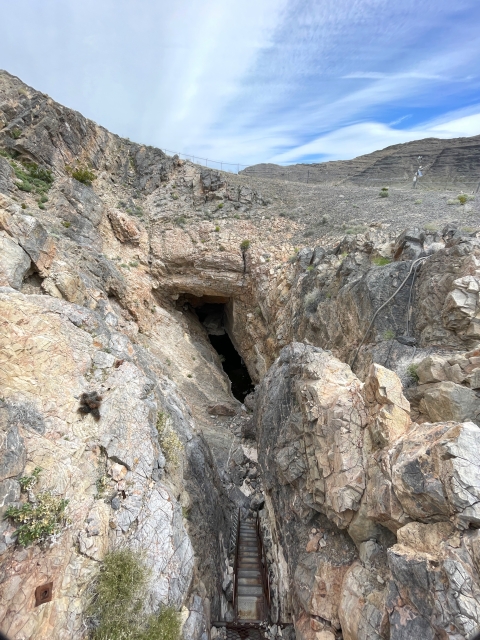 A small pool of water surrounded by rock