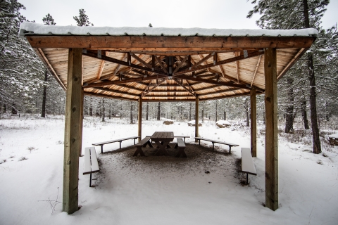 A snow covered gazebo