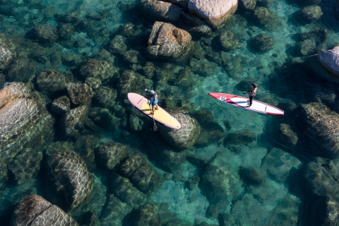 Two people on a paddleboard in a body of water