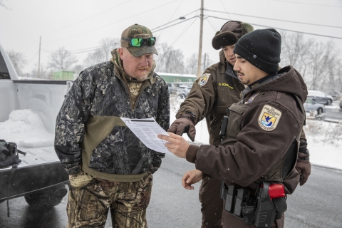 Refuge officers reviewing information