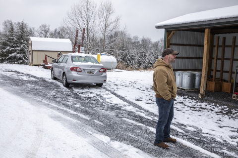 Refuge officer looking at building