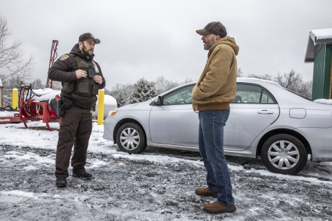 Refuge officer talking with a someone