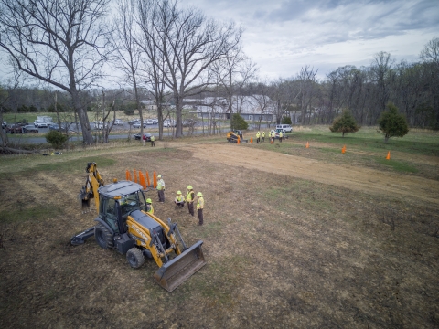 Tractor backhoe and students taken from an aerial view