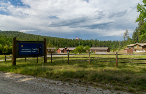 A blue entrance sign denotes the refuge headquarters at Little Pend Oreille NWR