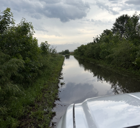 Vehicle approaches a flooded road