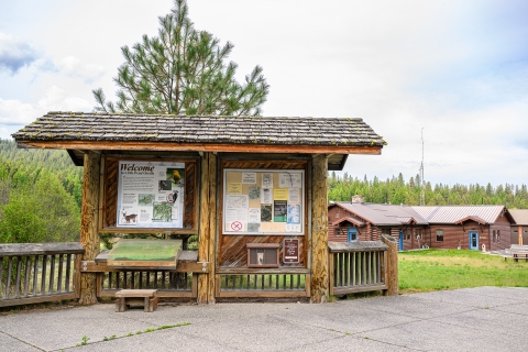 A wooden kiosk stands outside refuge headquarters