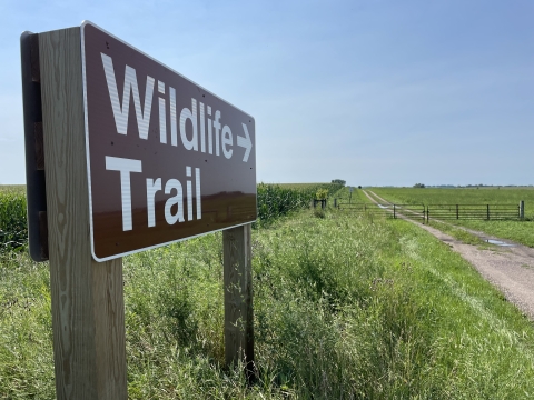 Auto Tour Route sign pointing to closed gate