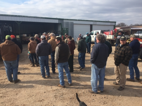 people standing in group at farm