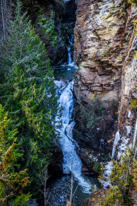 A waterfall flowing down a small canyon