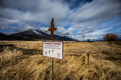 A sign describes proper shooting distances for hunters