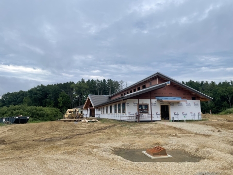 half constructed building sits on land in the middle of construction site