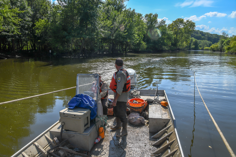 The boat is moving in crescent patterns to minimize prop wash into the trawl.