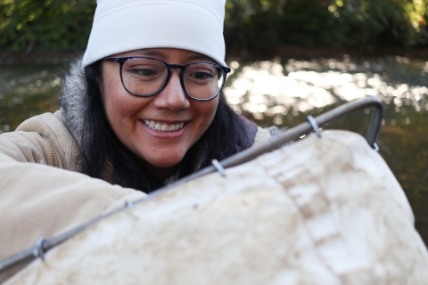 Woman looking into a small net