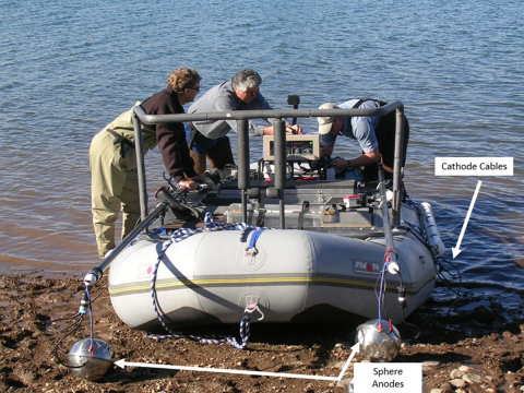 Raft electrofisher with two boom sphere anodes and cathode cables off both sides of the raft