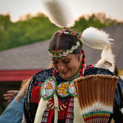 A woman dressed in a traditional Native American attire